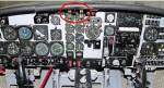 The engine fire warning lights and emergency engine shutdown handles were located at the top of the instrument panel (red circle).