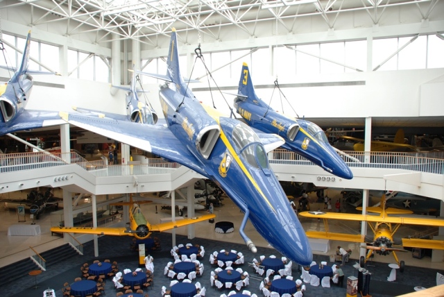 A flight of four A-4 Skyhawk Blue Angels aircraft hang suspended over the museum banquet room. (Amazing t think that this whole formation fits in this room.