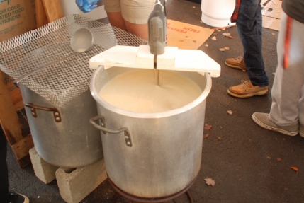 Buckets of clam chowder are moved to the main tent to be served up to hungry customers.